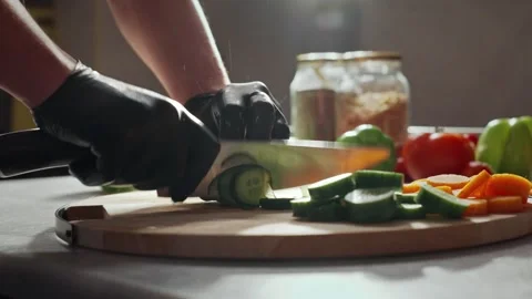 Chef using a knife cutting fresh raw sqaush. Stock Footage 267866273