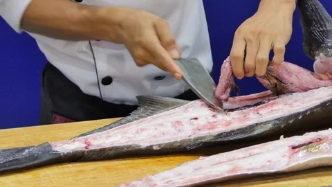Chef using knife was slice big fish. Stock Footage 109111214