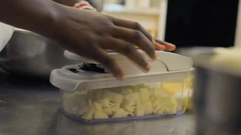 Chef Using Manual Chopper for Onion Preparation Stock Footage 339642774