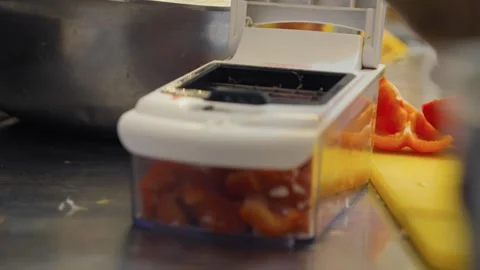Chef Using Vegetable Chopper for Red Peppers Stock Footage 339248728
