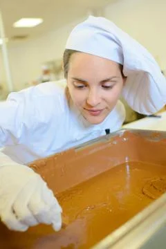 Chef with vat of syrup Stock Photos