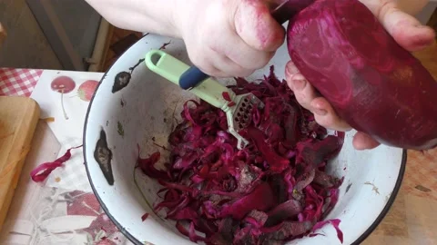 The chef washes and peels the beets with a knife Stock Footage 166707344
