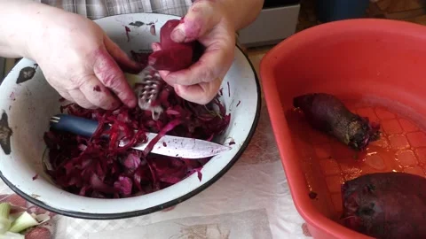 The chef washes and peels the beets with a knife Stock Footage 166707908