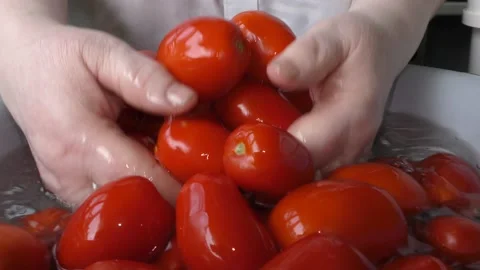 The chef washes the tomatoes with water Stock Footage 138721055