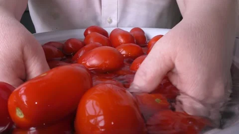 The chef washes the tomatoes with water Stock Footage 138721081