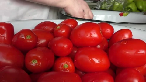 The chef washes the tomatoes with water Stock Footage 138721299