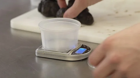 Chef weighing truffle Stock Footage 92077418