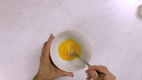 Chef whisking egg with fork Stock Footage 99542841