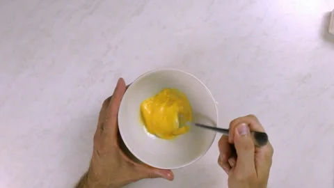 Chef whisking egg with fork Stock Footage 99542995