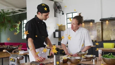Chef in white teaching, starting chopping on kitchen, chef in black studying, Stock Footage 333318039