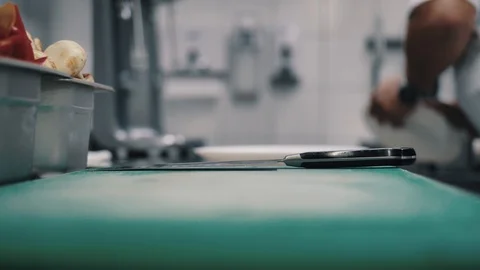 Chef wipes plates in the background Stock Footage 112587019