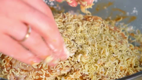 Chef woman hands preparing breaded chicken with instant noodles crust. Stock Footage 311885262
