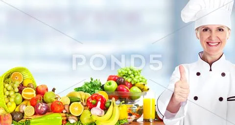 Chef woman with vegetables and fruits. Stock Photos