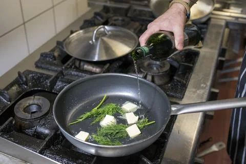 Chef at work in the kitchen, cooking delicious and healthy food Stock Photos