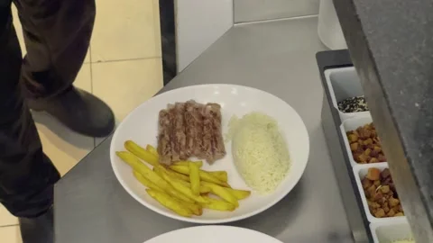 Chef working with meat plating rice and french fries at Restaurant 4k Stock Footage 218262917