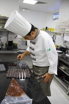 Chef working in the restaurant kitchen Stock Photos