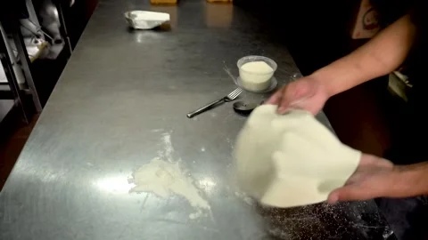 Chef working on shaping floured dough in restaurant. Top View Stock Footage 242778253