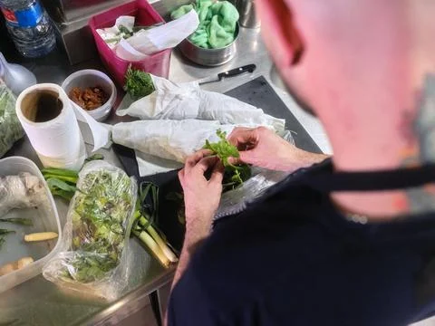 Chef working with some aromatic herbs in a restaurant kitchen Stock Photos