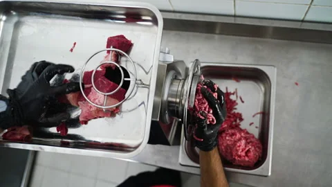 Chef works with meat grinder Stock-Footage 168886177