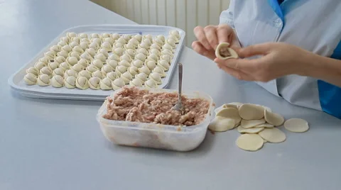 A chef is wrapping meat into the dumplings Stock Footage 67007835