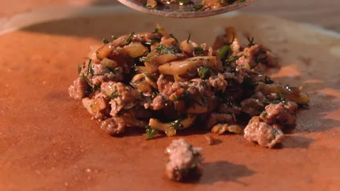 The chef wraps fried minced meat with mushrooms in pancakes Stock Footage 158021909