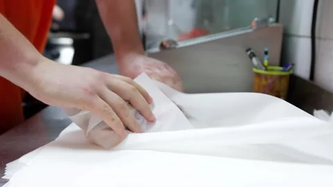 Chef Wraps Ready-Made Baguette Stuffed with Meat and Vegetables Stock Footage 288576740
