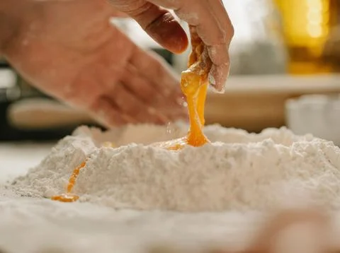 Chef&amp;#039;s Hands Kneading Bread Dough on a Floured Worktop Stock Photos