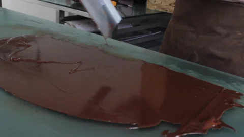 Cheff hands working with melted chocolate 動画素材 230708655