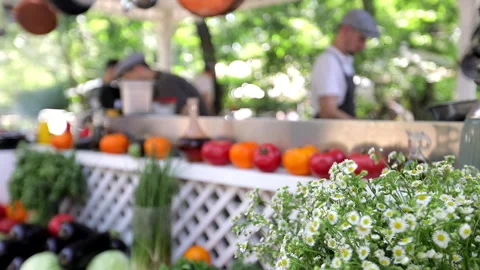 Chefs are cooking in the kitchen on the open summer area Stock Footage 245587566