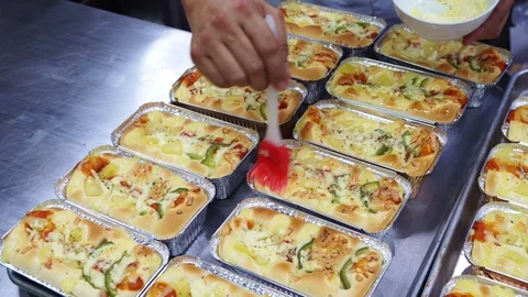 Chefs are delicious pizza bread buttered toast on baking done. Stock Footage 106055686