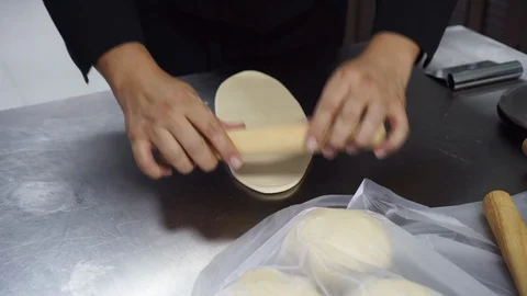 Chefs are using a dough roller to put the ham. Stock Footage 115345773