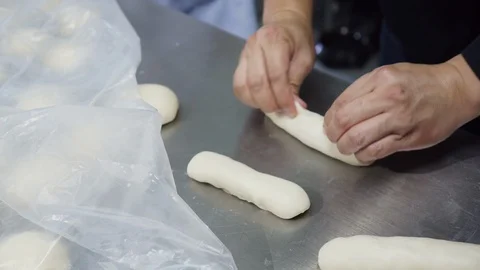 Chefs are using a dough roller to put the ham. Stock Footage 115348710