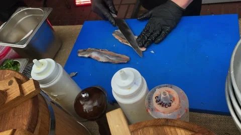 Chefs carve sea fish on the street during the festival Video stock 161043853