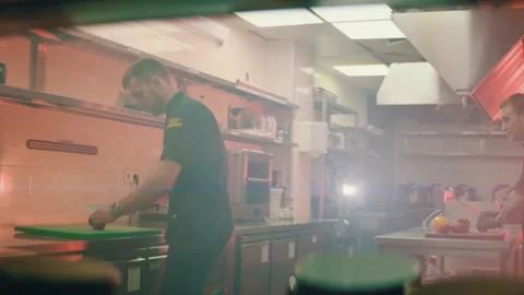Chefs chop vegetables in the kitchen Stock Footage 141157944