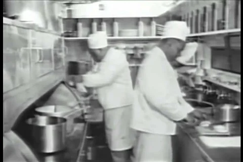 Chefs cook in a kitchen and passengers eat in a dining car and the Southern Stock Footage 99114215