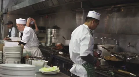 Chefs Cooking in an Asian Restaurant Kitchen Stock Footage