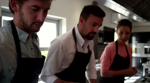 Chefs cooking food at kitchen. Stock Footage 64116404