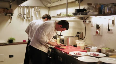 Chefs cooking in kitchen Stock Footage 34424333