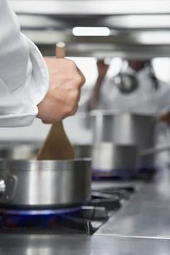 Chefs Cooking In Kitchen Stock Photos