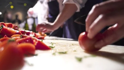 Chefs cut tomatoes Stock Footage 73908528