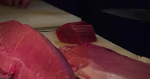 Chefs cutting with knife big bluefin tuna fish 4k video. Sushi Japanese cuisine. Stock Footage 67487662