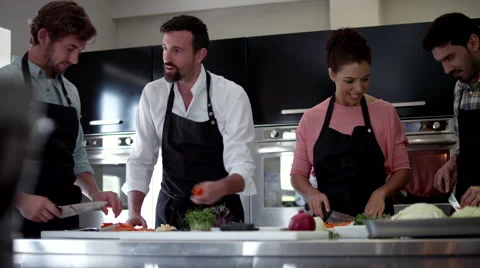 Chefs cutting vegetable at kitchen. Stock Footage 64115875