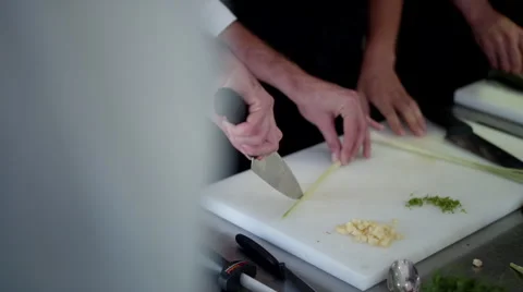 Chefs cutting vegetable at kitchen. Stock Footage 64115884