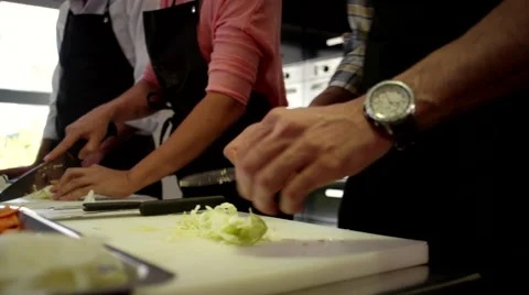 Chefs cutting vegetable at kitchen. Stock Footage 64115945