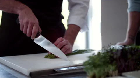 Chefs cutting vegetable in kitchen. Stock Footage 64116069