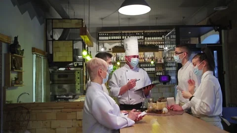 Chefs discuss the new restaurant menu. Stock Footage 147482291