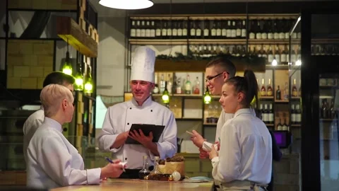 Chefs discuss the new restaurant menu. Video stock 147482293