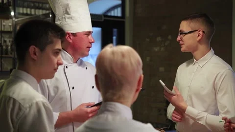 Chefs discuss the new restaurant menu. Stock Footage 147482303