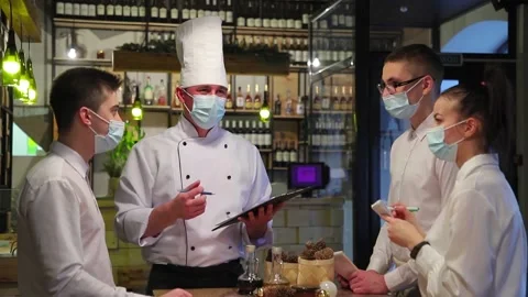 Chefs discuss the new restaurant menu. Stock Footage 147482304