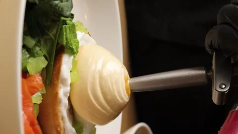 The chef's hand pours parmesan mousse Stock Footage 263730101